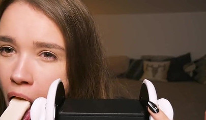 Playful teenie slobbers on her sex toys in an erotic ASMR video