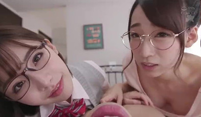 Young Japanese cuties give a sloppy blowjob before riding in a threesome