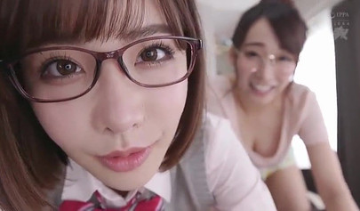 Young Japanese cuties give a sloppy blowjob before riding in a threesome