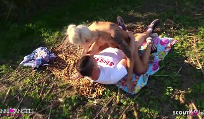 Busty blonde Anni Angel seduces a stranger outdoors