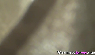 Sexy Asian teen in school uniform stroking her creamy pussy