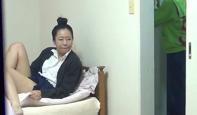 Sexy Asian teen in school uniform stroking her creamy pussy