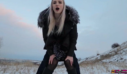 Adorable teen in a fur coat fucks in cold weather and swallows cum