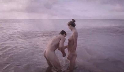 Nude girlfriend Charlotta milks her boyfriend's penis on the beach