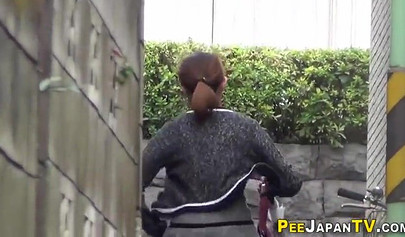 Shameless Asian teen babes caught peeing in public