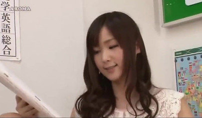 Sexy Japanese teacher spreads her legs and shows her pink panties