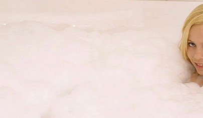 Gorgeous teen blonde washes her sexy body and poses nude