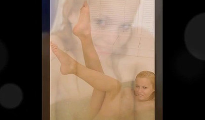 Gorgeous teen blonde washes her sexy body and poses nude