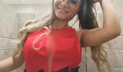 Breathtaking brunette films herself masturbating in public bathroom