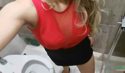 Breathtaking brunette films herself masturbating in public bathroom
