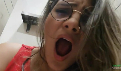 Breathtaking brunette films herself masturbating in public bathroom