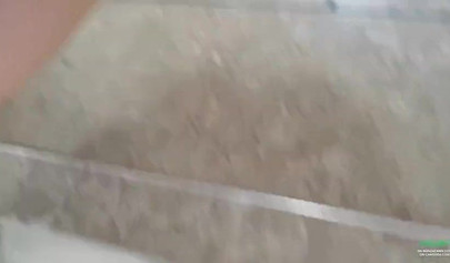 Breathtaking brunette films herself masturbating in public bathroom