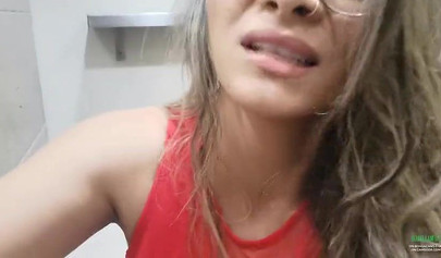 Breathtaking brunette films herself masturbating in public bathroom