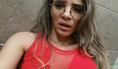 Breathtaking brunette films herself masturbating in public bathroom