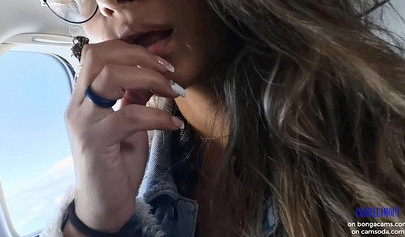 Smoking hot model shows her juicy tits and masturbates in the plane