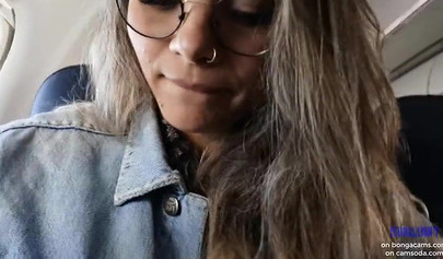 Smoking hot model shows her juicy tits and masturbates in the plane