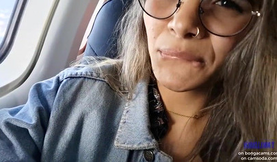 Smoking hot model shows her juicy tits and masturbates in the plane