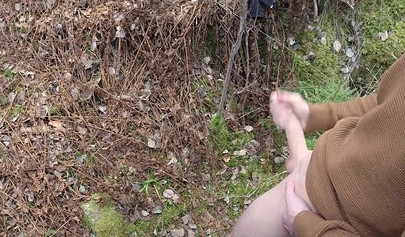 Playful teen catches a big dicked dude masturbating outdoors and helps him cum
