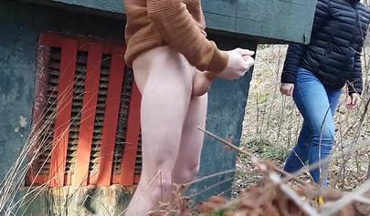 Playful teen catches a big dicked dude masturbating outdoors and helps him cum
