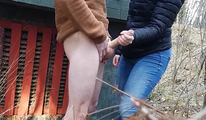 Playful teen catches a big dicked dude masturbating outdoors and helps him cum