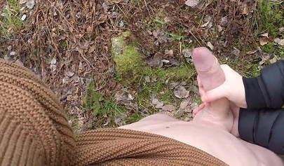 Playful teen catches a big dicked dude masturbating outdoors and helps him cum