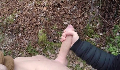 Playful teen catches a big dicked dude masturbating outdoors and helps him cum