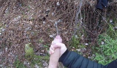 Playful teen catches a big dicked dude masturbating outdoors and helps him cum