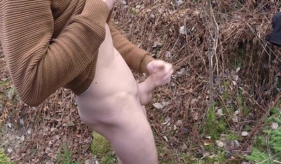 Playful teen catches a big dicked dude masturbating outdoors and helps him cum