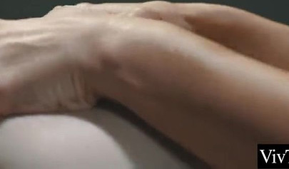 Attractive lesbian masseuse pleasing a big boobed teenage babe on the table