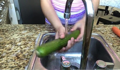 Naughty teen deepthroats a cucumber and inserts it in her asshole