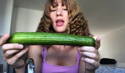 Naughty teen deepthroats a cucumber and inserts it in her asshole