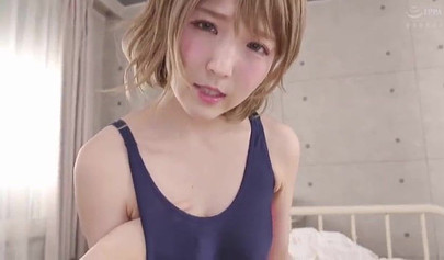 Cute Japanese teen in a swimsuit massages a tiny Asian dick