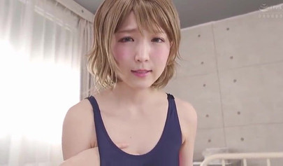 Cute Japanese teen in a swimsuit massages a tiny Asian dick