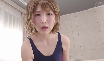 Cute Japanese teen in a swimsuit massages a tiny Asian dick