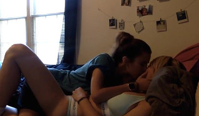 Hot brunette fingering and eating busty blonde's pussy