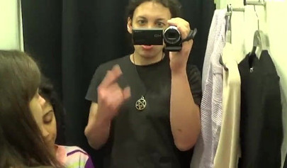 Two amateur girlfriends take care of a hard dick in the changing room