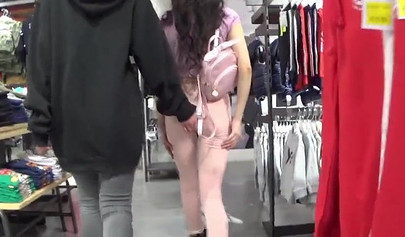 Two amateur girlfriends take care of a hard dick in the changing room