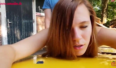 Horny German brunette got her pussy drilled on the car in public