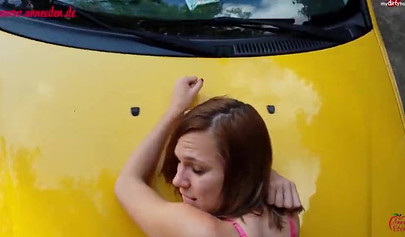 Horny German brunette got her pussy drilled on the car in public