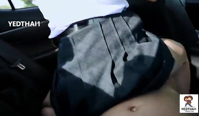 Thai chick in a school uniform fucking in a car