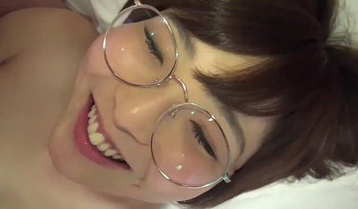 Asian hottie with nerdy glasses playing with kinky toys