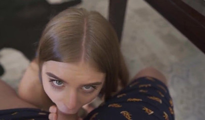 Gorgeous brunette teen sucking a big cock under the diner table