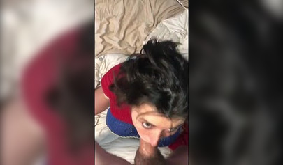 Busty amateur brunette teen giving a sloppy blowjob in bed