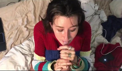 Busty amateur brunette teen giving a sloppy blowjob in bed