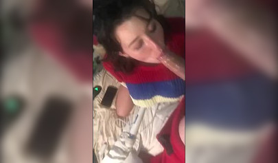 Busty amateur brunette teen giving a sloppy blowjob in bed