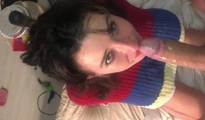 Busty amateur brunette teen giving a sloppy blowjob in bed