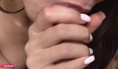 Close-up of a brunette teen giving a sensational blowjob