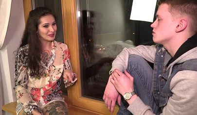 Tattooed milf with big boobs fucking a young man's shaft