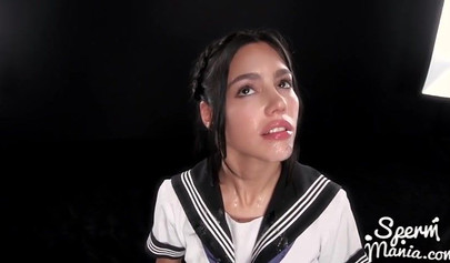 Sweet teen in a schoolgirl uniform milks a hard cock