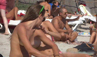 Sexy teens flashing their natural tits at the nude beach